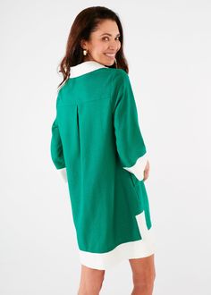 Want to feel easy, breezy, and chic this Summer? This high-style mini caftan in a popping kelly green is just the thing to help you channel your inner 60's movie star. The drapey, lightweight linen fabric will keep you cool while the covered buttons, color-blocked trim, and collar will deliver style that can take you beyond poolside hangouts. Sizing: Generous fit - We recommend that if you are between sizes to size downMake: Collared with covered buttons and contrast trim. In-seam pockets. Measu Green V-neck Tunic For Fall, Green Tunic For Spring Daywear, Green Tunic For Daywear, Green Long Sleeve Tunic For Daywear, Easy Breezy, Long Shorts, New Arrival Dress, The Thing, Contrast Trim