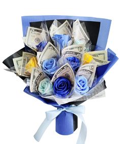 a bouquet of money and roses wrapped in blue paper