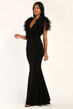 Make any entrance an unforgettable one when you arrive wearing the Lulus Fabulous Fun Black Tulle Flutter Sleeve Mermaid Maxi Dress! This stunning dress is composed of stretchy techno crepe knit that shapes a princess-seamed bodice and a V-neckline. Sheer tulle fabric creates an overlay that gathers atop the bodice and eye-catching short flutter sleeves that add the perfect amount of dramatic flair. The high, fitted waist tops a curve-hugging skirt that boasts a mermaid silhouette before falling Black Tie African Attire, Black Tie Charity Event Dress, Black Tulle Bridesmaid Dress, Mother Of The Bride Black Dress, All Black Black Tie Wedding, Black Dresses For Wedding Guest, Winter Formal Wedding Guest Dress, Black Bridesmaid Dresses With Sleeves, Black Long Formal Dresses