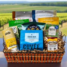 a basket filled with coffee and snacks on top of a table