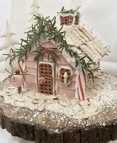 a gingerbread house with candy canes on the roof