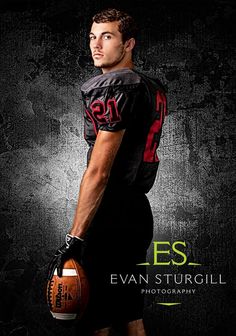 a man holding a football in his right hand and wearing a black shirt with red letters on it