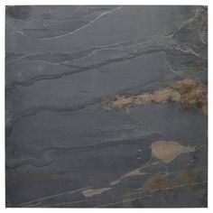 a black marble slab with brown and tan accents