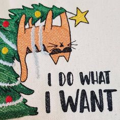 i do what i want christmas tree with orange cat on it and yellow stars in the background