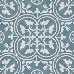 a blue and white tile pattern with an ornate design in the center, as well as circles