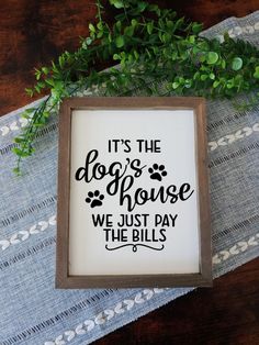 it's the dog's house we just pay the bills framed wood sign