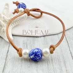 Looking for a unique gift for your loved one or maybe just a little something for yourself? Check out our Pearl and Chinoiserie Bead Bracelet for Women! This bohemian layering bracelet features beautiful blue chinoiserie glass beads and genuine freshwater pearls, hand-strung on real leather cord. Each piece is individually handmade and ships quickly from Florida. Choose from sizes 6.5 inch (small), 7.0 inch (medium - most popular), 7.5 inch (large), or 8.0 inch (xl). If you have a special request for a custom size, simply leave a note during checkout and we'll make it happen. This bracelet is perfect for anyone who loves non-metal jewelry and wants to add a touch of bohemian style to their wardrobe. To see more of our unique handmade jewelry, check out our shop: https://bohemeltd.etsy.com. Bohemian Single Strand Beaded Bracelets As Gift, Adjustable Single Strand Bracelet As Gift, Layering Jewelry, Blue Chinoiserie, Bracelet For Her, Great Gifts For Women, Layered Jewelry, Unique Handmade Jewelry, Layered Bracelets