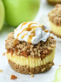 there are two desserts on the table with apples in the backgroung