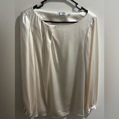 Chic Ivory Colored Satin Blouse With Long Sleeve And Silver Buttons. Brand New. Elegant Cream Long Sleeve Tops, Elegant Long Sleeve Cream Tops, Elegant Cream Office Tops, Elegant Long Sleeve Cream Blouse, Chic Cream Formal Top, Spring Cream Blouse For Formal Occasions, Spring Formal Cream Blouse, Classic Cream Top For Party, Cream Blouse For Spring Formal Occasions