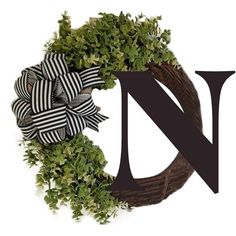 a black and white wreath with the letter n on it