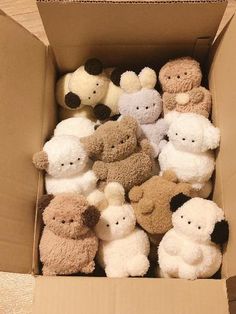 a box filled with lots of stuffed animals