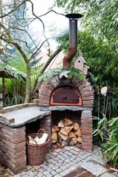 an outdoor brick pizza oven with logs in it