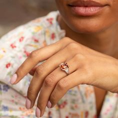 The Story Beautiful in color and style, this vintage ring will stop you in your tracks. Done in platinum, it centers around a gorgeous Imperial Topaz weighing approximately 4.80 carats. The stone sits in a four-prong setting with six single cut diamonds, each weighing approximately 0.03 carats, tapering down the sides. The unique stone has the most beautiful hue. In the orange-pink family, it looks like a sunset. Measuring 0.4 inches tall it looks amazing on the finger. A ring like this is a jewelry staple you'll wear for years to come. The Specs Style Number: R2542 Vintage, circa late 20th century Platinum Imperial Topaz, 4.80 carats, 10.4 x 9.1 mm (approx.) 12 single cut diamonds, each 0.03 carats (approx.) Total diamond weight approximately 0.32 carats Height of front face of ring 0.40" Timeless Topaz Anniversary Ring, Luxury Baguette-cut Topaz Ring, Luxury Radiant Cut Topaz Ring For Anniversary, Classic Radiant Cut Topaz Ring With Accent Stones, Fine Jewelry Topaz Ring Baguette Cut, Fine Jewelry Topaz Ring With Baguette Cut Center Stone, Jewelry Staples, Imperial Topaz, Front Face