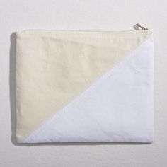 Our "Threes" pouch set is a collection of 3 color-blocked, double-sided pouches made from up-cycled, 10 oz canvas. Re:Canvas is a “no scrap left behind” design project in which we up-cycle our U.S.A. grown, milled & dyed cotton canvas in new and unique ways. The "Threes" pouch set is our 12th Re:Canvas installment. Colors: Natural, Light Green, Light Grey, Khaki, White, Black Large Pouch 10" x 8" natural/white on one side, natural/khaki on the other side Circle Pouch 8" x 8" black on one side, n White Cotton Pouch For Everyday Use, Large Pouch, Small Pouches, Left Behind, Green Light, Design Project, Natural Light, Design Projects, Light Green