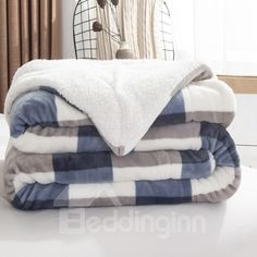 three blankets stacked on top of each other