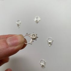 "These are soooooo pretty. Made is 925 sterling silver with tribal details, set with a grounding smokey quartz stone. The rings are all 1cm (.40\") in diameter. The wire is 20 gauge. Each piece is made BY HAND so there may be very slight differences One of the images contains numbers to specify which you would like from the drop down menu." Dainty Silver Pierced Nose Rings, Dainty Tiny Silver Septum Ring, Small Silver Dainty Septum Ring, Dainty Silver Small Septum Ring, Handmade Minimalist Sterling Silver Septum Ring, Silver Open Ring Septum As Gift, Dainty Silver Nose Rings, Silver Open Ring Septum Gift, Dainty Silver Hypoallergenic Septum Ring