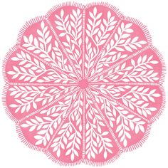 a pink and white paper cut design with leaves