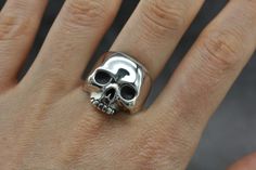 Our classic silver skull ring is a staple in your skull ring collection, hand crafted from sterling silver. This bold statement piece captures the spirit of risk-taking and embraces unapologetic attitude. Show off your style and set yourself apart with this unique and captivating ring, a great look on both men and women. Originally hand carved from wax, now cast into silver, we size each one of our skull rings by hand to fit you perfectly. Each and everyone of our rings are finished by hand with Black Skull Ring, Skull Engagement Ring, Mens Skull Rings, Skull Rings, Silver Skull Ring, Classy Aesthetic, Skull Jewelry, Ring Collection, Diy Rings