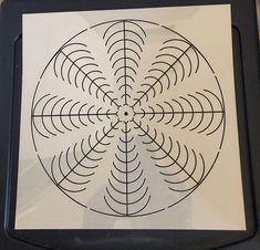 an image of a circular design on a piece of paper that has been cut out