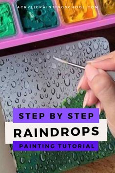 someone using scissors to paint rainbows in their art supplies with the words step by step raindrops painted on them