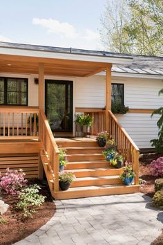 a small house with steps leading up to the front door