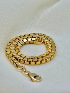 "18k Solid Gold Box Chain Bracelet , 2mm ,8\" , 6.100 gr  18k Solid Gold Box Chain Bracelet , 2.7 mm ,8\" , 11.15 gr Please text me if you want specific size . Priced to sell! Compare our prices to other similar sellers! Arrives in a GIFT BOX and includes FREE SHIPPING within the USA and Canada. International shipping is available at the most economical rates on ETSY. I HAVE BEEN IN THE JEWELRY BUSINESS ALL MY LIFE. I am a second -generation family member making gold and jewelry. Please feel free to ask me any questions - Always happy to help! Fast Replies to messages! Superior Quality and Best Prices!" 14k Gold Snake Chain Bracelet As Gift, Gold Plated Snake Chain Bracelet As Gift, Anniversary Yellow Gold Box Chain Bracelet, Box Chain Link Bracelet For Gift, Yellow Gold Box Chain Bracelet As Gift, Gold Plated Box Chain Bracelet Gift, Gold Bracelet With Box Clasp And Rectangular Links, Rectangular Gold-plated Bracelet For Gift, Rectangular Box Chain Bracelet As Gift