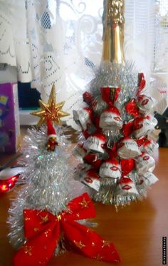 two christmas trees made out of candy wrap