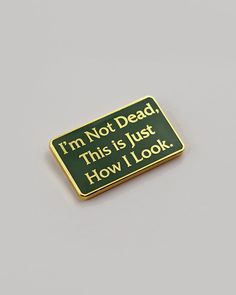 I'm not dead, this is just how I look. Hard enamel pin Gold metal details Double pinbacks for support Artist brand stamp on back Measurements: 1.25" x .75" By Inner Decay Listen Linda, Battle Jackets, Pins Diy, Backpack Ideas, Pins Enamel, Fandom Jewelry, Brand Stamp, Genesis 3