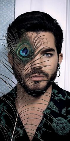 a man with a peacock feather on his face and the image is split in half