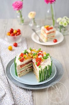 there is a cake that has been cut in half and served on a plate with other plates