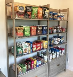 a shelf filled with lots of different types of food and snacks on top of it