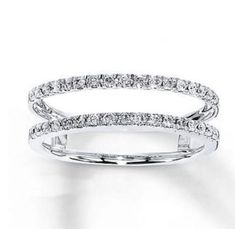 a white gold ring with diamonds on it