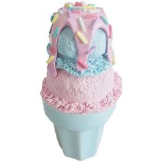 an ice cream cone with sprinkles and frosting