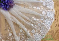 white lace with purple flowers on it