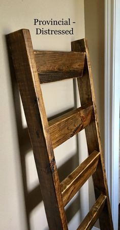 a wooden ladder leaning against the wall