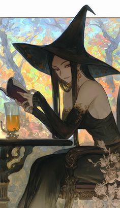 a woman in a witches hat sitting at a table with a glass of beer on it