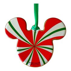 a mickey mouse christmas ornament hanging from a green cord