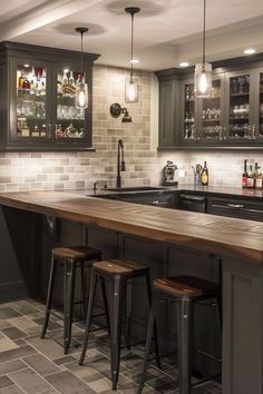 a kitchen with an island and bar stools