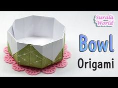 an origami bowl is sitting on a doily with the words bowl in front of it