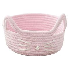 a pink cat shaped basket with white trimmings on the bottom and ears in the center