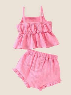 Dress your little one in charming elegance with our 2-piece Baby Girl Flower Applique Cami and Bloomers Set. This delightful outfit features a cute cami top adorned with delicate flower appliques, adding a touch of sweetness to her look. The matching bloomers complete the ensemble, ensuring comfort and style for your baby girl. Perfect for warm weather, this set is ideal for casual outings, family gatherings, or playdates. Crafted from soft, breathable fabric, it promises to keep your baby girl Spring Ruffled Solid Sets, Spring Ruffled Solid Color Sets, Cute Fitted Sets, Cute Fitted Solid Color Sets, Cute Solid Color Playwear Sets, Cute Solid Color Summer Sets, Sweet Cotton Sets With Ruffles, Sweet Pink Sets With Ruffles, Cute Sleeveless Solid Color Sets