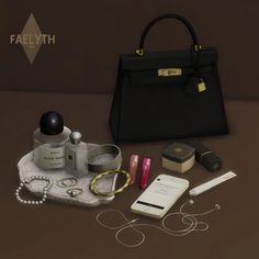 the contents of a woman's purse are laid out next to her handbag