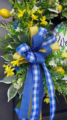 a blue and white wreath with yellow flowers