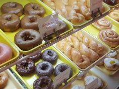 there are many different types of doughnuts on display