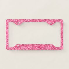 a pink license plate frame with the word melrose written on it in white glitter