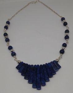 This beautiful Lapis Lazuli necklace has 6 mm beads in Lapis and silver plate. The chevron pieces measure from 6 mm to 30 mm. The wire is silver plated copper and the chain is also silver plated. Great for work or a night on the town. Chevron Necklace, Hematite Necklace, Lapis Lazuli Necklace, Jade Earrings, Amethyst Earrings, Jade Pendant, Necklace Silver, Lapis Lazuli, Silver Necklaces