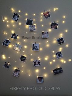 a string of lights with pictures hanging from it