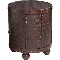 a round wooden table with metal studs on the top and bottom, sitting on wheels