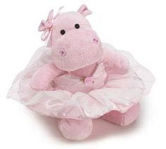 a pink stuffed animal in a tutu skirt