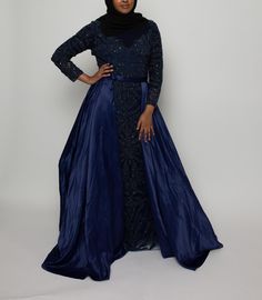 This exquisite navy blue gown combines sophistication with modesty, making it perfect for any special occasion. Crafted with intricate, heavy beaded detailing in a delicate pattern across the bodice and skirt, this dress shimmers beautifully with every movement. The luxurious satin overskirt adds depth and a touch of elegance, while the long sleeves and high neckline make it ideal for modest fashion enthusiasts. Whether for weddings, galas, or formal events, this dress offers both comfort and refined style. Pair it with a hijab or any elegant accessory to complete the look. For other sizes or customization requests, please DM us - we're here to ensure the perfect fit for your special day! Elegant Hijab, Navy Blue Gown, Long Sleeve Dress Formal, Blue Gown, Beaded Gown, Refined Style, Nov 6, Elegant Accessories, Dress Clothes For Women